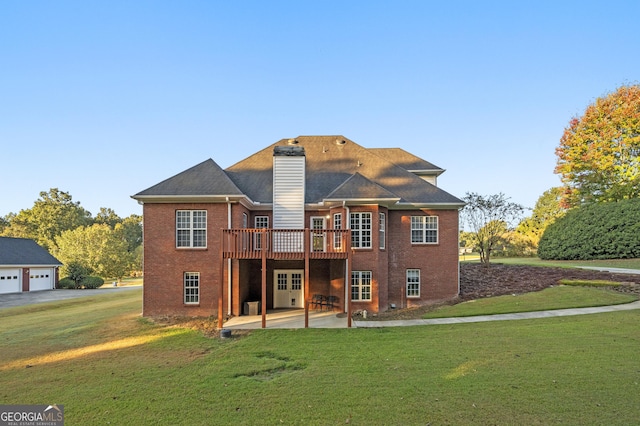 back of house with a wooden deck, a yard, and a patio area