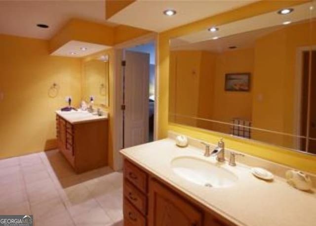 bathroom with vanity and tile patterned floors