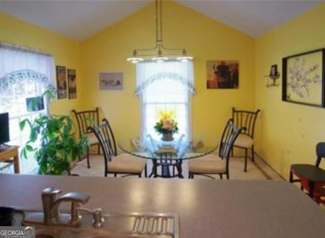 dining area with lofted ceiling