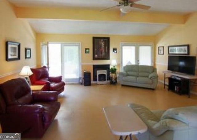 living room with ceiling fan and beam ceiling