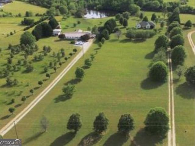 aerial view featuring a water view and a rural view