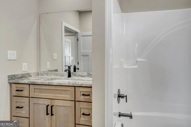 full bathroom with vanity, wood-type flooring, bathtub / shower combination, and toilet