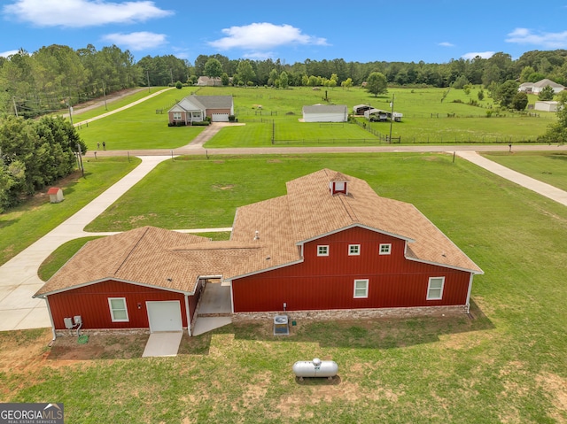 birds eye view of property with a rural view