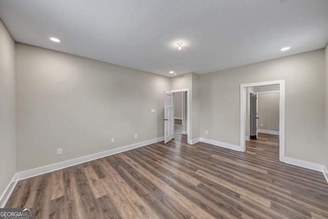 unfurnished bedroom with dark hardwood / wood-style floors