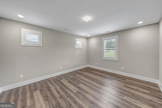 spare room featuring dark hardwood / wood-style floors