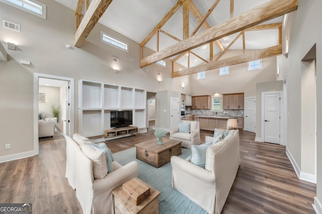 living room with lofted ceiling with beams and dark hardwood / wood-style floors