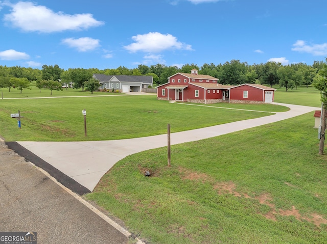 view of front of property with a garage and a front yard