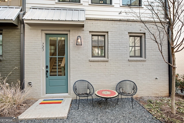 entrance to property with a patio area