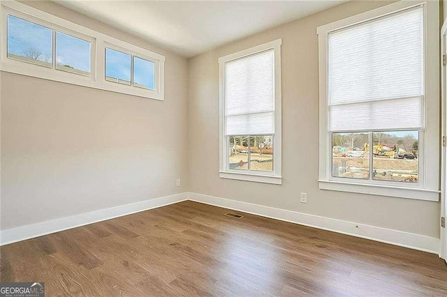 empty room featuring hardwood / wood-style floors