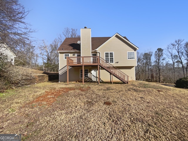 back of property with a wooden deck