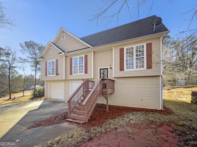 split foyer home featuring a garage