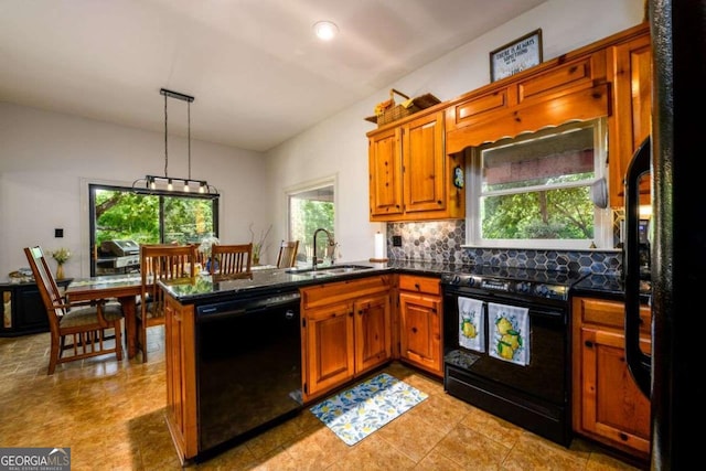 kitchen with sink, backsplash, hanging light fixtures, black appliances, and kitchen peninsula