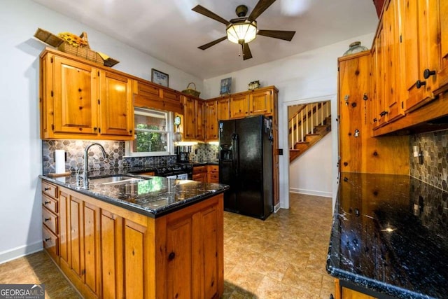 kitchen featuring sink, backsplash, black refrigerator with ice dispenser, kitchen peninsula, and dark stone counters