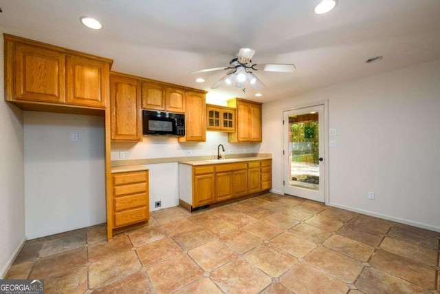 kitchen featuring sink and ceiling fan