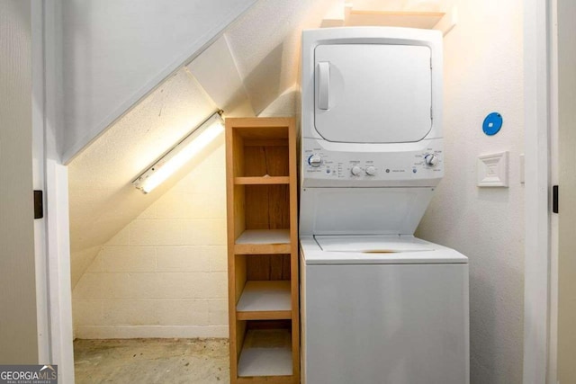 laundry room featuring stacked washer / dryer