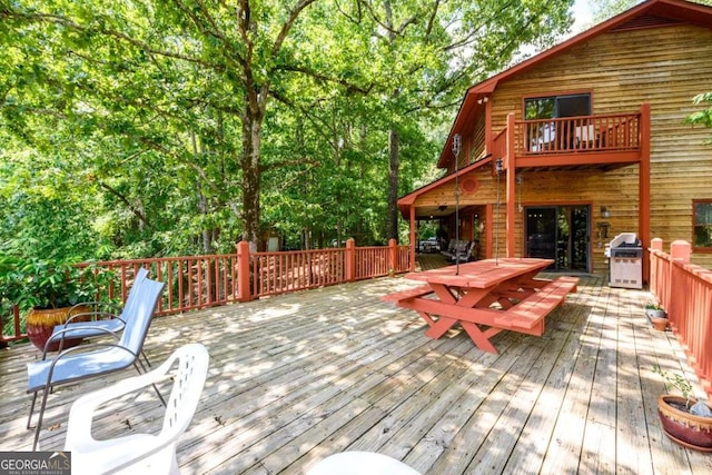 wooden deck featuring area for grilling