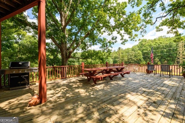 wooden deck featuring grilling area