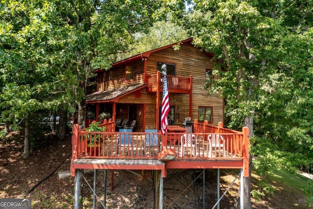 rear view of house with a deck