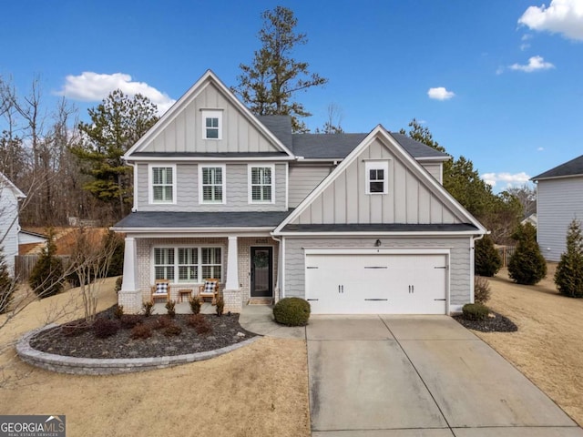 view of front of property featuring a garage and covered porch