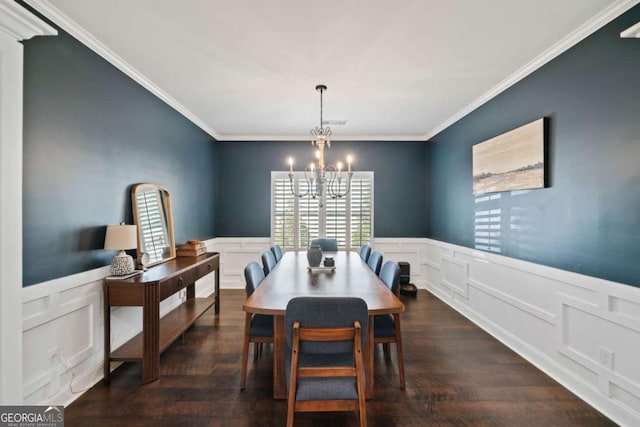 dining space featuring a notable chandelier, dark wood-type flooring, and ornamental molding