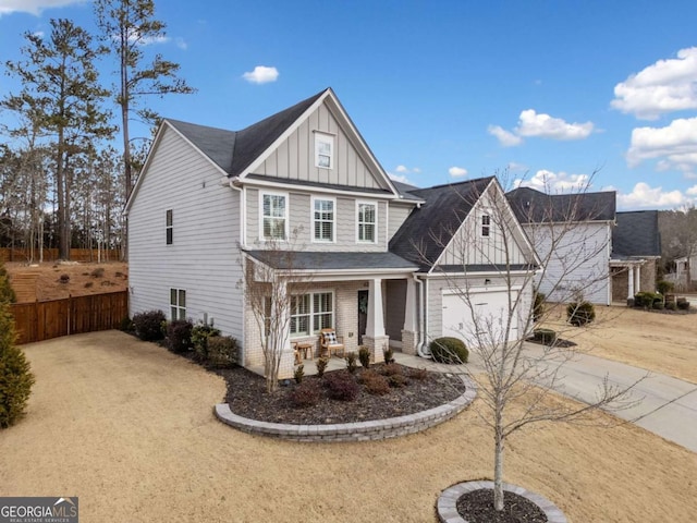 view of front of house with a porch and a garage