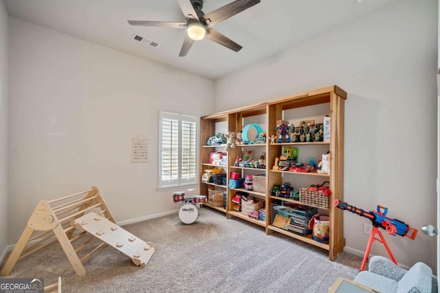 playroom with ceiling fan and carpet floors