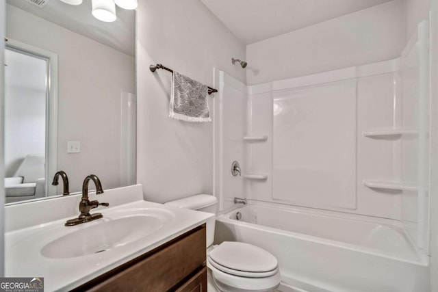 full bathroom with shower / tub combination, vanity, and toilet