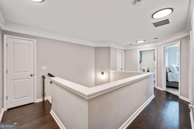 corridor with crown molding and dark hardwood / wood-style flooring