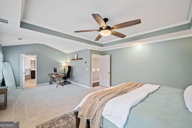 bedroom with ceiling fan, ornamental molding, a tray ceiling, and light carpet