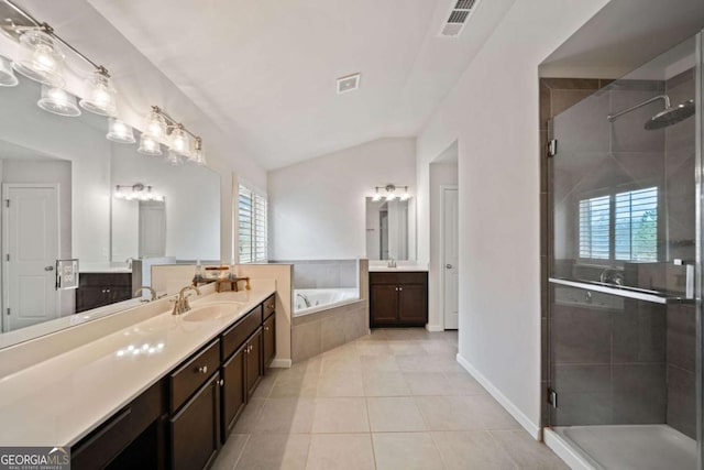 bathroom featuring plus walk in shower, lofted ceiling, tile patterned floors, and vanity