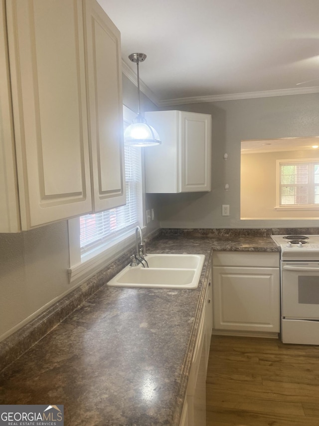 kitchen featuring white cabinetry, sink, and electric stove