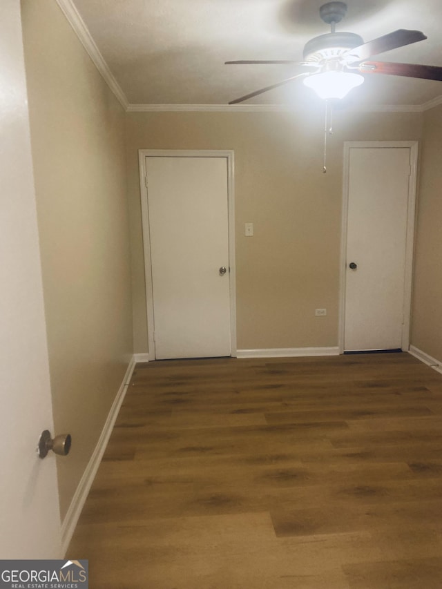 unfurnished room featuring hardwood / wood-style flooring, ornamental molding, and ceiling fan