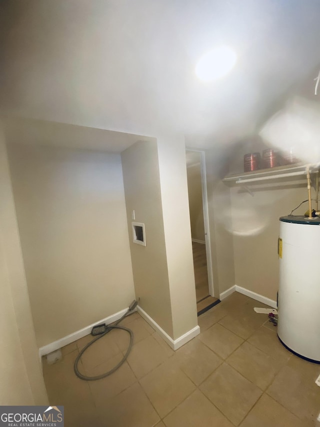 interior space featuring tile patterned floors, hookup for a washing machine, and water heater