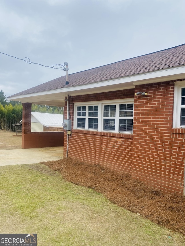 view of property exterior with a lawn