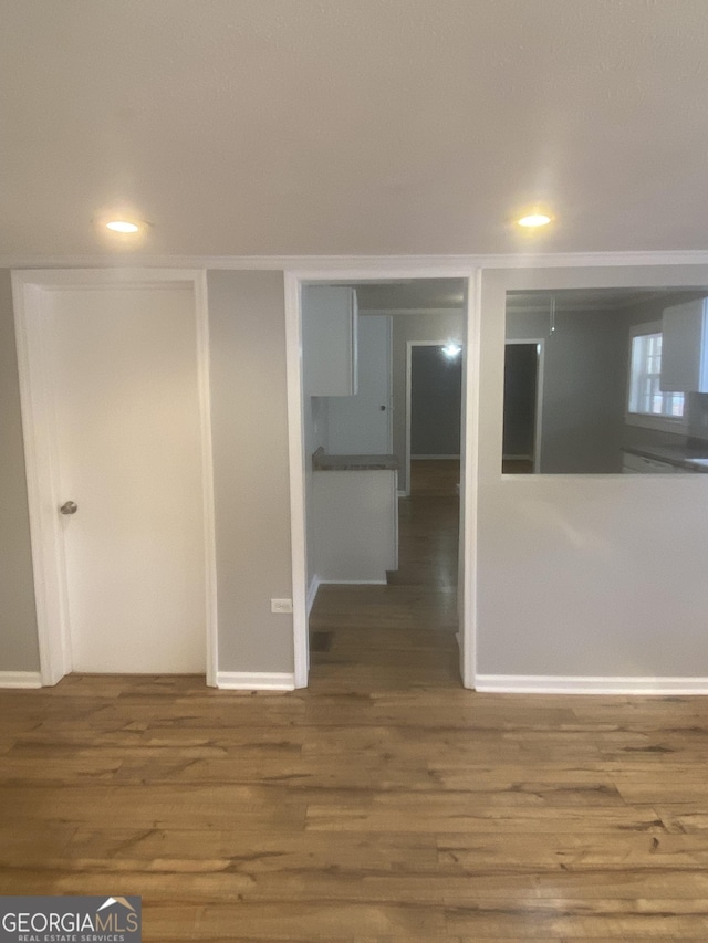 empty room with wood-type flooring