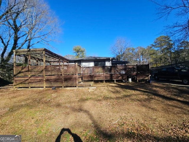 view of yard featuring a wooden deck