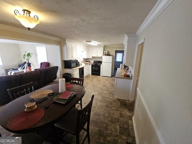 dining room with crown molding and a textured ceiling