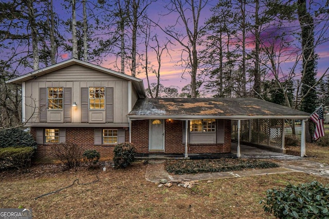 split level home featuring a carport