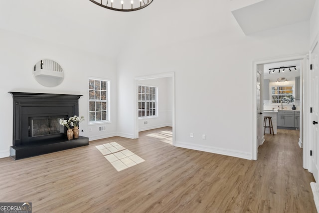 unfurnished living room featuring light wood-type flooring