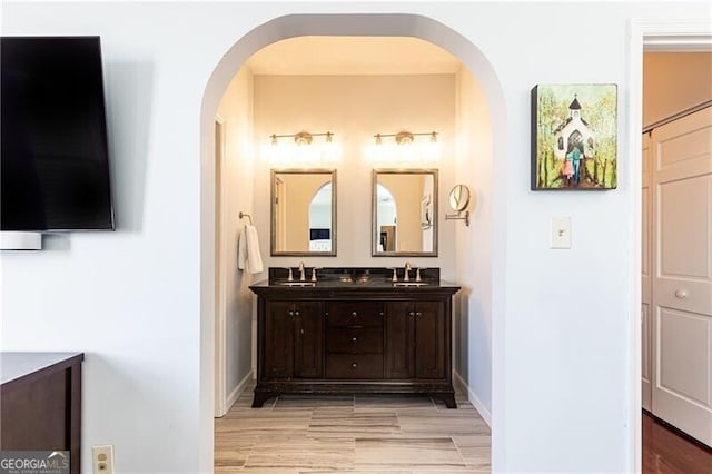 bathroom with hardwood / wood-style flooring and vanity