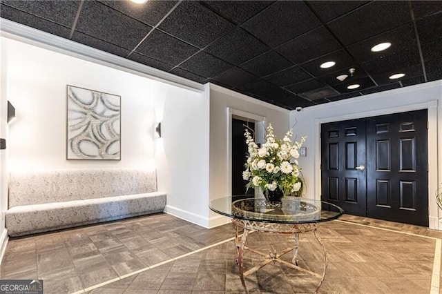 foyer entrance featuring ornamental molding