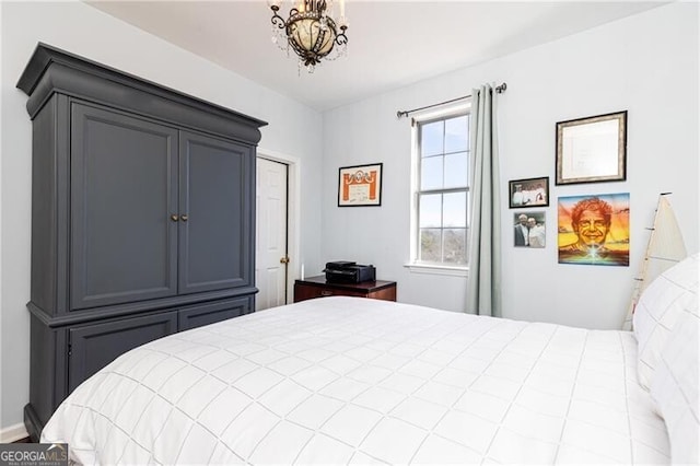 bedroom with an inviting chandelier