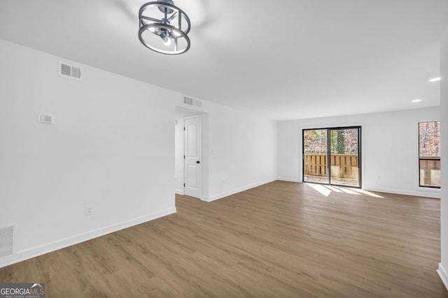 unfurnished living room featuring hardwood / wood-style flooring