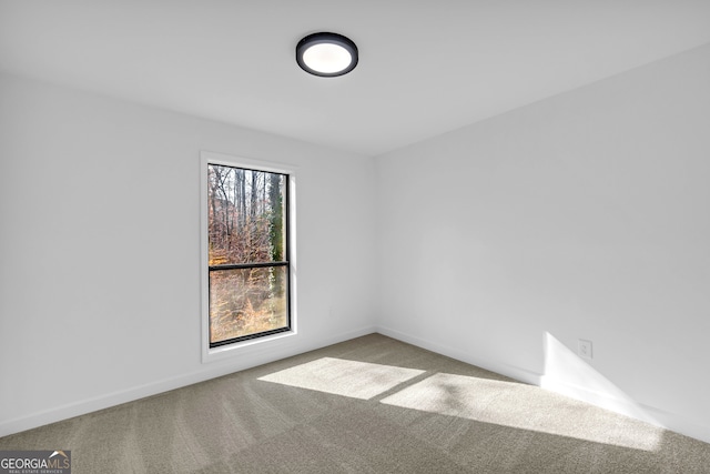 empty room featuring light colored carpet