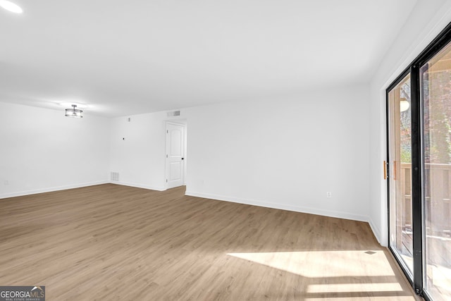 unfurnished room featuring light hardwood / wood-style flooring