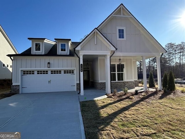 1109 Cooks Farm Way, Woodstock, GA 30189 - view of front of property featuring a garage, board and batten siding, and concrete driveway