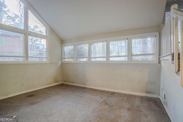 unfurnished sunroom featuring vaulted ceiling