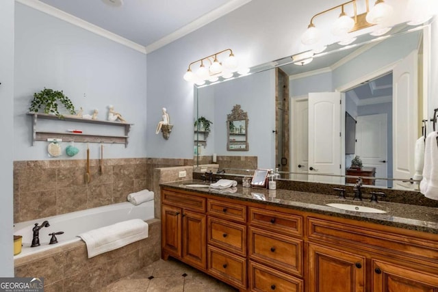 bathroom featuring crown molding, vanity, tiled bath, and tile patterned flooring