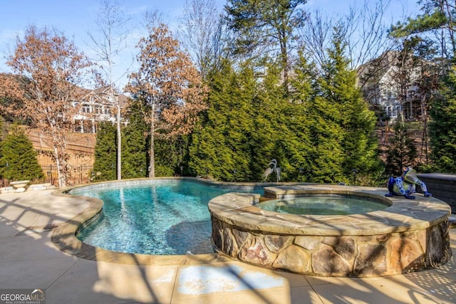 view of pool featuring an in ground hot tub and a patio area