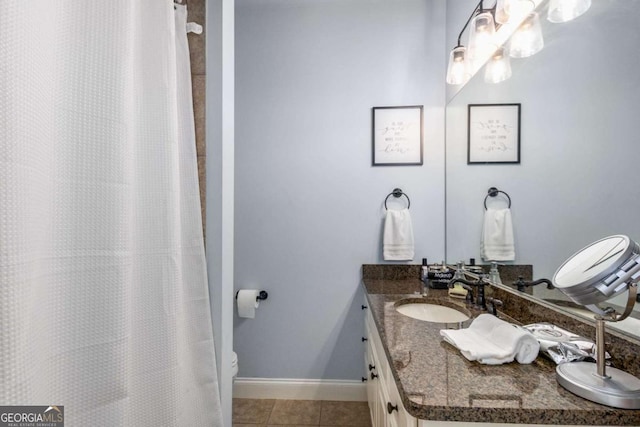 bathroom with vanity, tile patterned floors, and toilet